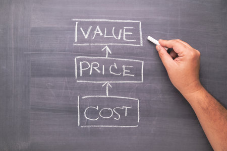 Hand writing on blackboard, a chart of Value, Price, and Cost, as the success of product and service development, marketing conceptの写真素材