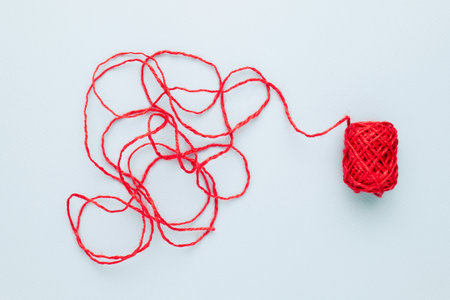 Red jute rope with complicated end of rope, unravels the confused ropeの写真素材