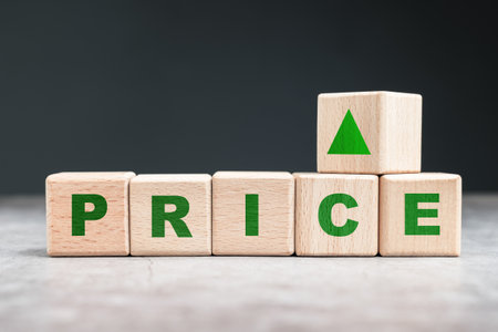 Price topic arranged by alphabet wood cubes with increase sign, increase, or raise the priceの写真素材