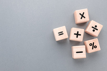 Mathematics operation signs by wood cubes, learning mathematics, and calculation conceptの写真素材