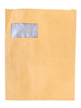 A used brown envelope for A4 document with blank address box covered with transparent plastic, isolated on white backgroundの写真素材