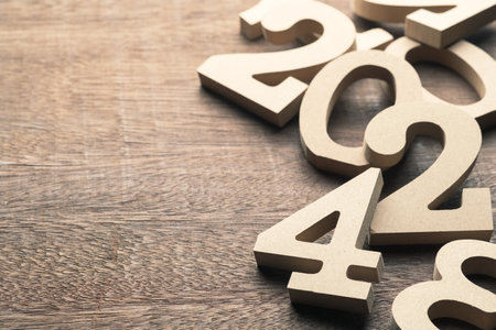 2024 in the pile of wooden numbers on the wood table, 2024 year