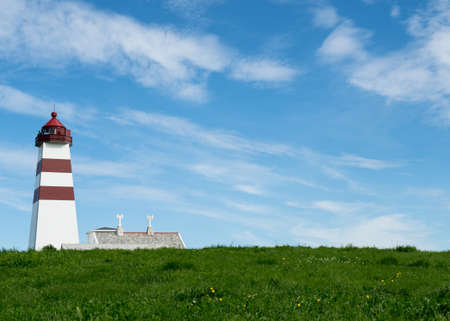 Lighthouse in summer, Alnes,  Godoy island, on the west coast  in Norwayの写真素材