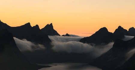 Cloudy sunset sky in top mountain at Reine, lofoten,Norwayの写真素材