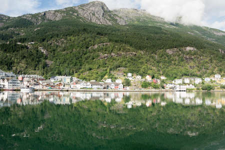 Odda Town with small houses on a Fjord in Summer, Norwayの写真素材