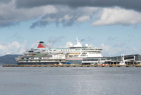 Cruise ship sails in Norwegian sea fjord, Bergen in summer, Norwayの写真素材