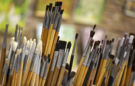 painter in front of his paintingsの写真素材