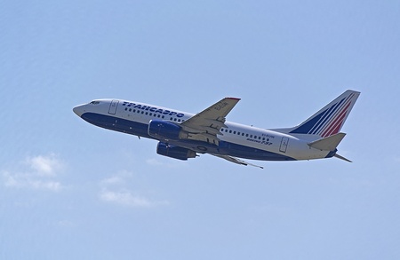 KIEV, UKRAINE - July 31 Boeing 737 aircraft airline Transaero flies in Boryspil International Airport on July 31, 2013 in Kiev, Ukraineのeditorial素材
