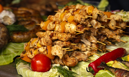 grilled meat on coals on skewers.の写真素材
