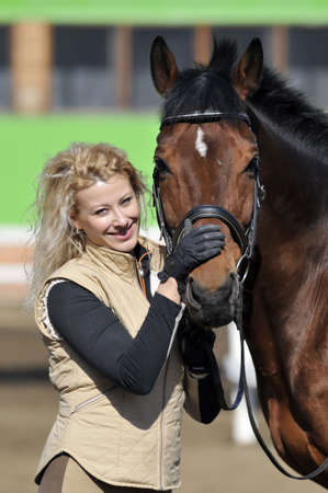 beautiful girl with the brown horseの写真素材