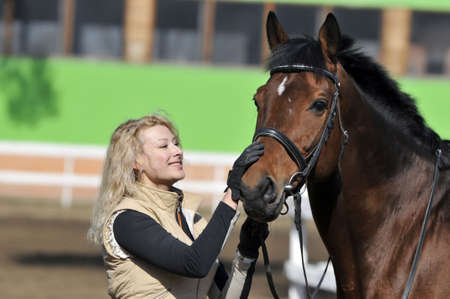 beautiful girl with the brown horseの写真素材