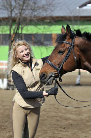 beautiful girl with the brown horseの写真素材
