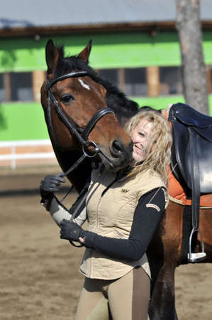beautiful girl with the brown horseの写真素材
