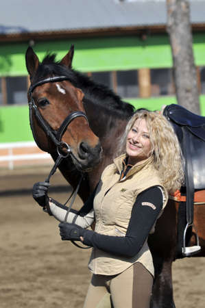 beautiful girl with the brown horseの写真素材