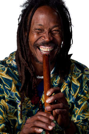 Man plays a traditional wooden flute, studio imageの写真素材