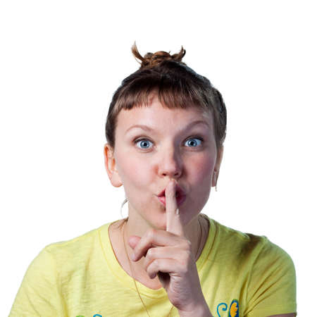 Woman tells people to be quiet, fingers on lips