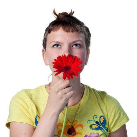 Young woman with a flower in her hairの写真素材