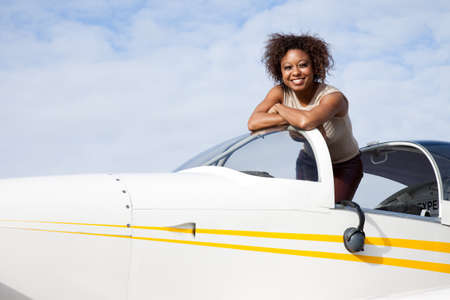 Pilot and plane on the runwayの写真素材