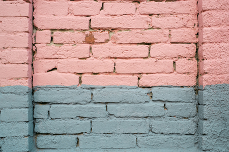 Pink and gray painted brick wall detailの写真素材