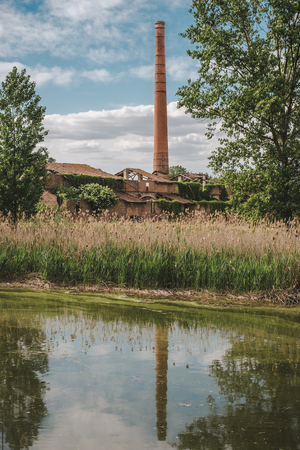 Old brick factory ruins in a humid area. Campotto, Ferrara province, Emilia Romagna, Italy.の写真素材