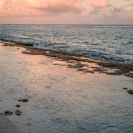 sea reflecting light from the clouds at sunset time. San AndrÃ©s island, Colombia.の写真素材