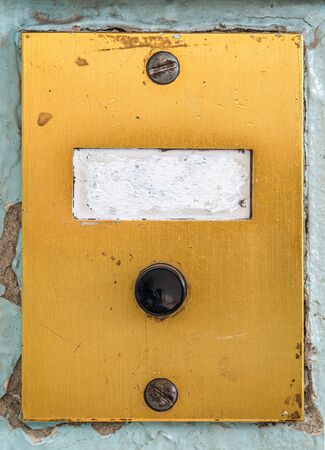 old doorbell plate with blank erased label