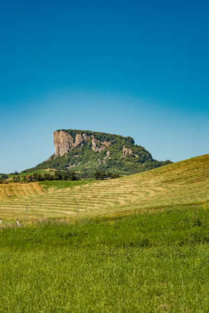 The Pietra di Bismantova (Stone of Bismantova) viewed from the ground.  Castelnovo ne' Monti, Reggio Emilia province, Emilia Romagna, Italy.の写真素材