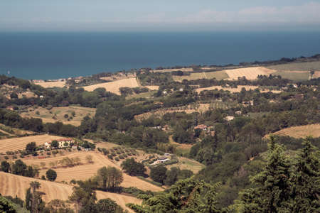 The hills in front of the Adriatic sea in the province of Pesaro and Urbino, Marche, Italyの写真素材