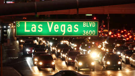 LAS VEGAS, NEVADA USA - DEC 13, 2019: Traffic sign glowing on The Strip in fabulous sin city. Iconic...
