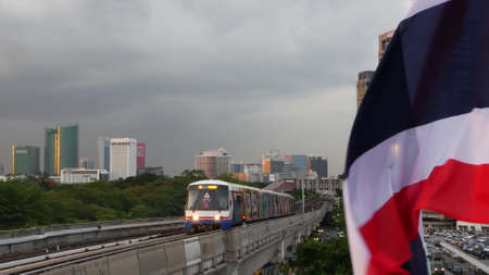 BANGKOK, THAILAND - 10 JULY, 2019: View of modern asian city from bts sky train platform. Train on...