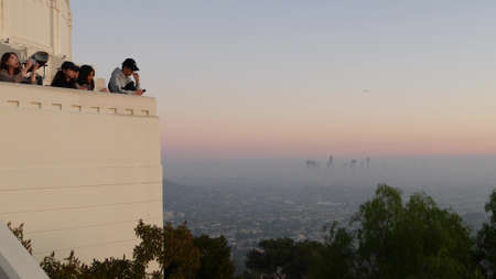 LOS ANGELES, CALIFORNIA, USA - 7 NOV 2019: Griffith observatory viewpoint. Crowd on vista point,...
