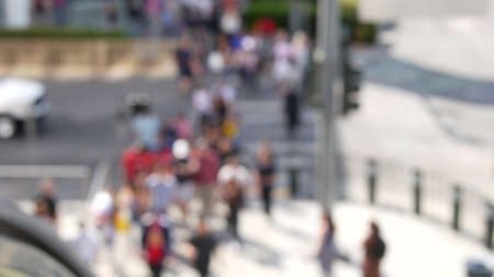Defocused crowd of people, road intersection crosswalk on The Strip of Las Vegas, USA. Anonymous blurred pedestrians on walkway in crowded urban downtown. Unrecognizable american citizens in sin city.の写真素材