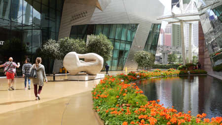 LAS VEGAS, NEVADA USA - 7 MAR 2020: Men and women in The Crystals rich shopping mall. Multiracial citizens inside luxury contemporary premium store. People purchasing in chic metropolis retail center.のeditorial素材