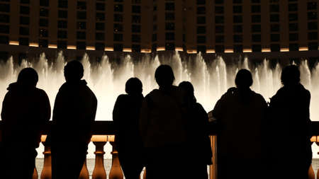 LAS VEGAS, NEVADA USA - DEC 13, 2019: People looking at Bellagio fountain musical performance at...