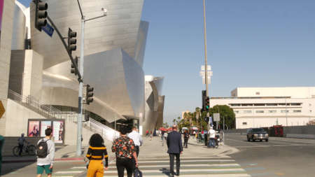LOS ANGELES, CALIFORNIA, USA - OCT 30, 2019: People walking in metropolis, pedestrians on walkway in...