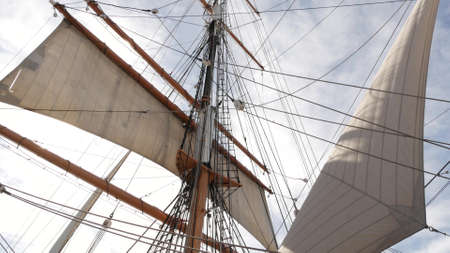 SAN DIEGO, CALIFORNIA USA - 30 JAN 2020: Retro sailing ship Star of India, full rigged wooden masts of Maritime Museum. Historic British frigate with white sails and ropes. Old large barque sailboat.のeditorial素材