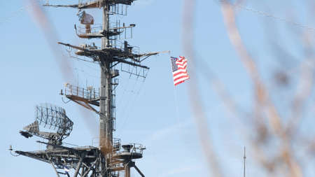 SAN DIEGO, CALIFORNIA USA - 4 JAN 2020: Radar of USS Midway military aircraft carrier, historic war ship. Naval army battleship with American flag. Maritime steel warship in port, navy fleet symbol.のeditorial素材