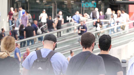 LAS VEGAS, NEVADA USA - 7 MAR 2020: People on pedestrian walkway. Multicultural men and women walking on city promenade. Crowd of citizens on sidewalk. Diversity of multiracial faces in metropolis.のeditorial素材