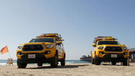 Oceanside, California USA - 8 Feb 2020: Yellow lifeguard car, beach near Los Angeles. Coastline...