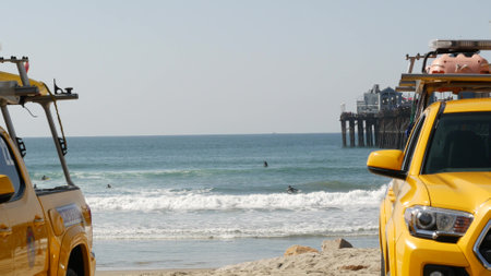 Oceanside, California USA - 8 Feb 2020: Yellow lifeguard car, beach near Los Angeles. Coastline rescue, life guard Toyota pick up truck, lifesavers vehicle. Iconic auto on ocean coast. Public safety.のeditorial素材