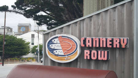 Monterey, California USA - Dec 13, 2020: Cannery Row road sign, tourist landmark. Fisherman wharf, retro industrial street with canning companies, sardines factory. Travel sightseeing. Bay aquarium.のeditorial素材