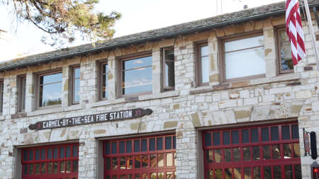 Carmel By The Sea, California USA - 10 Dec 2020: Red gates of cute fire station, city near Monterey....