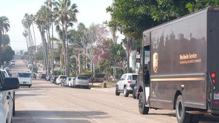 San Diego, California USA - Nov 21, 2020: UPS mail truck on city street, neighborhood residential...