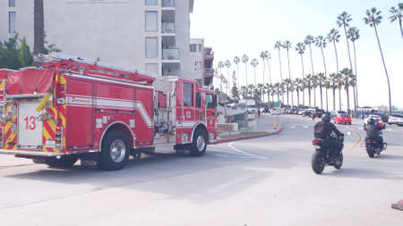 La Jolla, California USA - 23 Nov 2020: Red firefighters fire truck engine, emergency lifeguard...