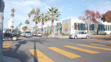 San Diego, California USA - 21 Nov 2020: People walking on yellow zebra, pedestrians on crossroad of...