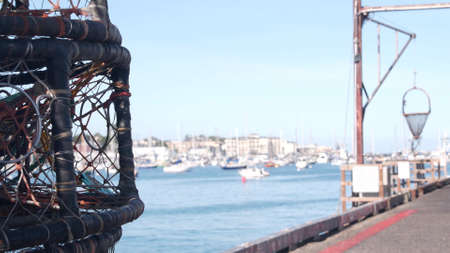 Traps, ropes and cages on pier, commercial dock, fishing industry, Monterey California USA. Empty...