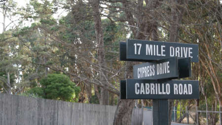 Scenic 17-mile drive wooden road sign, Monterey peninsula, Big Sur, California, USA. Coastal...