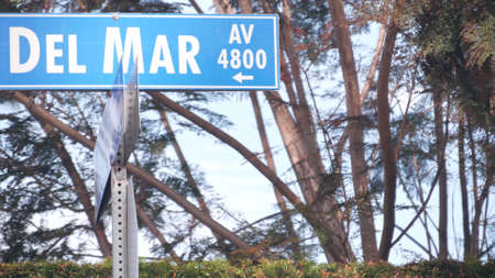Del Mar road sign on crossroad, California city street, USA. Waterfront tourist resort near Los Angeles, beachfront travel destination for waterside summer coastal vacations. San Diego county.の写真素材