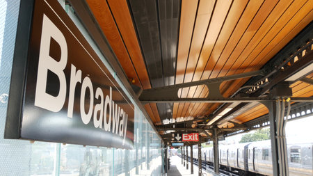 New York subway station Broadway text sign. Metropolitan train on platform, United States public...
