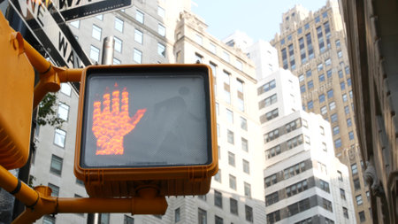 New York City street crossroad, pedestrian yellow traffic light, oneway transport road intersection. Building architecture. One way arrow road sign. Manhattan downtown financial business district, USAの写真素材